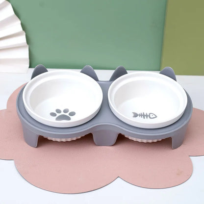 Pet ceramic feeding bowl, double bowl, inclined angle to hold food and water, protect the cat's cervical spine.